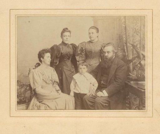 Group portrait of a man, three women and a child