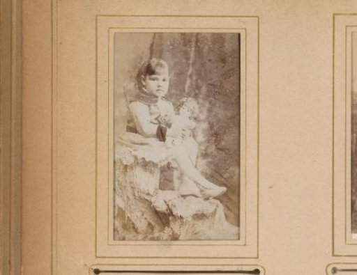 Portrait of a girl with a doll