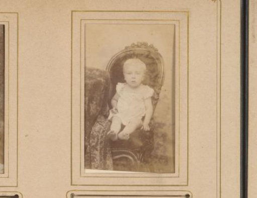 Portrait of a child seated on a chair
