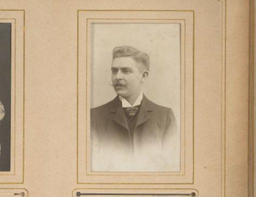Portrait of a man with a moustache, facing left