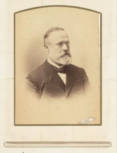 Portrait of a man with a beard and spectacles