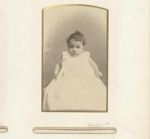 Portrait of a baby in a christening gown