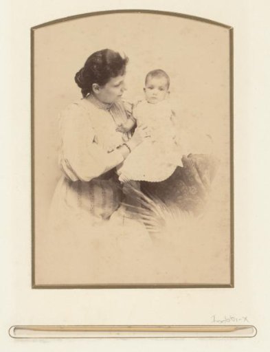Portrait of a sitting woman with a baby in her arms