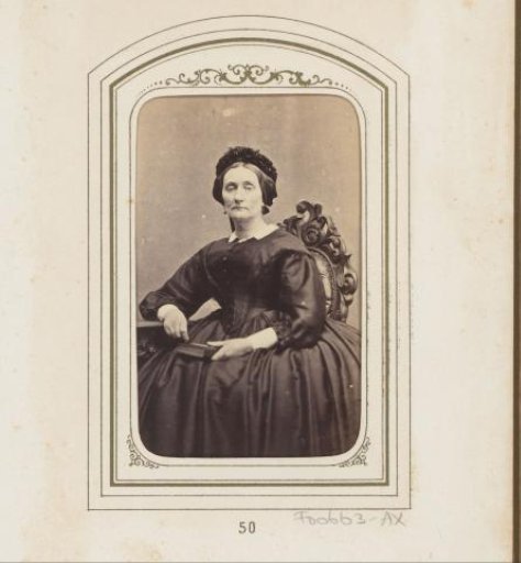Portrait of a seated woman with a cap and a book