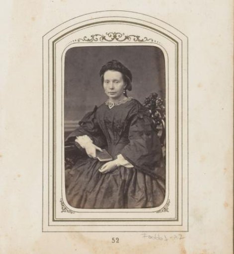 Portrait of a seated woman with a book