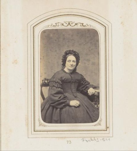Portrait of a seated woman with a cap