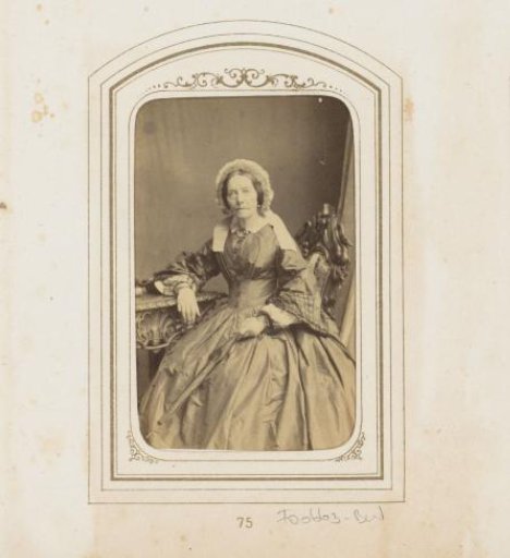 Portrait of a seated elderly woman with a cap