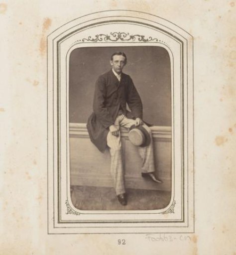 Portrait of a seated man on a balustrade with a hat in his hand