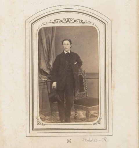 Portrait of a standing man with a hat in his hand