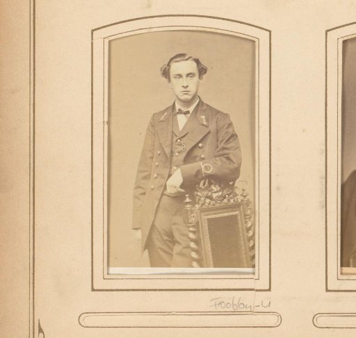 Portrait of a young man with insignia on his coat