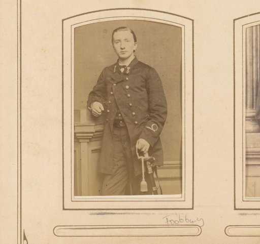 Portrait of a young man with insignia on his coat and saber