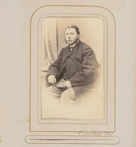 Portrait of a seated man with a book