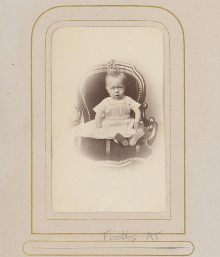 Portrait of a toddler on a chair