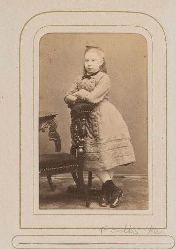 Portrait of a girl leaning on a chair