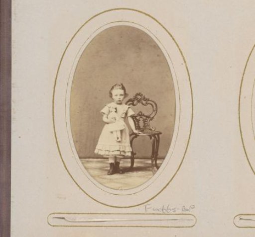 Portrait of a girl with a doll