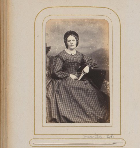Portrait of a woman with a cap and a book