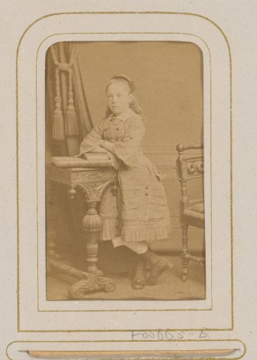 Portrait of a Girl Leaning on a Desk with Books