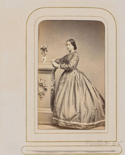 Portrait of a Woman Beside a Vase with Flowers