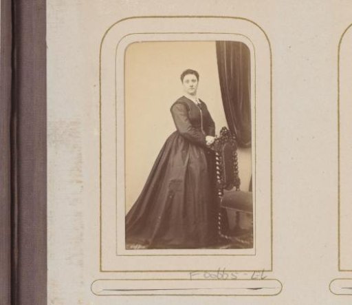 Portrait of a Woman with a Long Necklace Beside a Chair