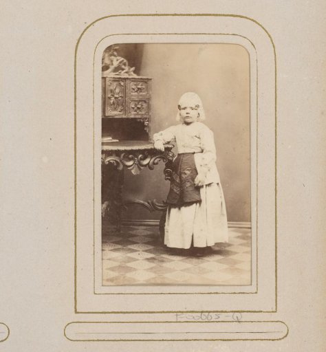 Portrait of a Girl in Frisian Costume at a Desk
