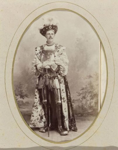 Portrait of a young man in costume with a sword