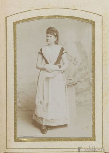Portrait of a standing woman in costume