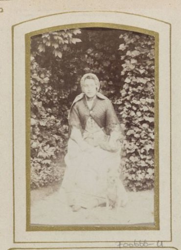 Portrait of a woman with a basket in her hand and a dog