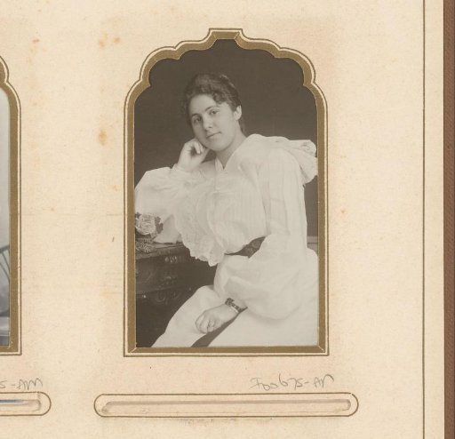 Portrait of a seated woman in a white dress