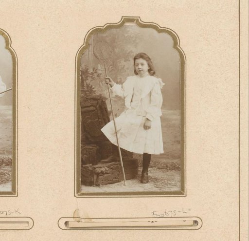 Portrait of a girl in a white dress with a net