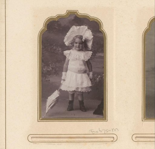 Portrait of a girl in a white dress with a large white hat, parasol and gloves