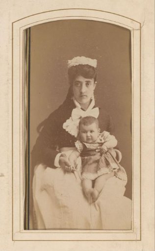 Portrait of a seated woman with a baby on her lap
