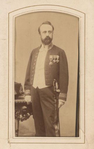 Portrait of a standing man in uniform with decorations
