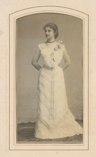 Portrait of a standing woman in a white gown