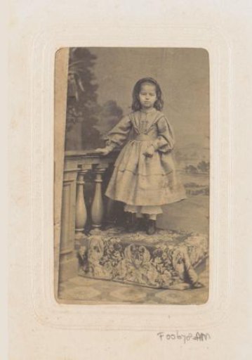 Portrait of a girl on a raised platform by a balustrade