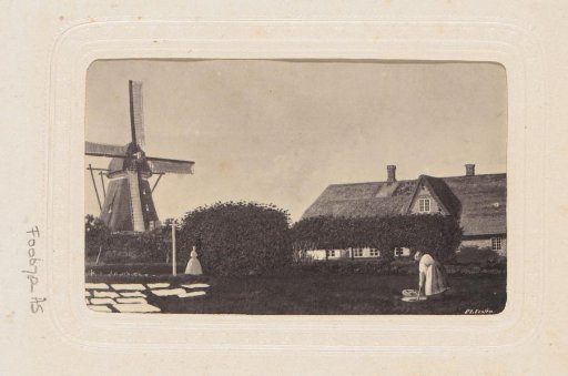 Photographic reproduction after a painting by C.L. Lesjen with a Dutch landscape with mill and bleachery