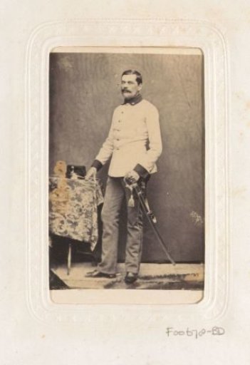 Portrait of a standing man with a sabre