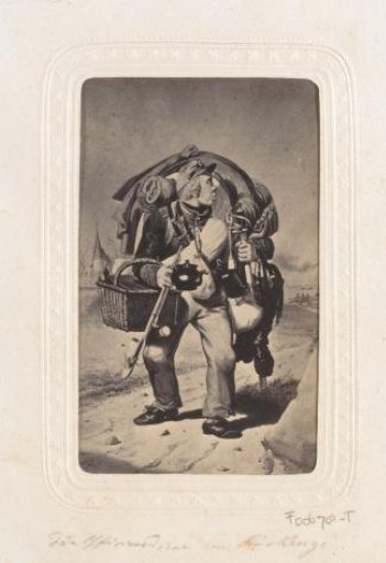 Photographic reproduction of a design with a military man with equipment