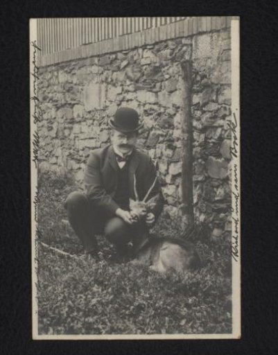 Portrait of a seated man with bowler hat and glasses kneeling beside a roe deer, the man is inscribed as Richard