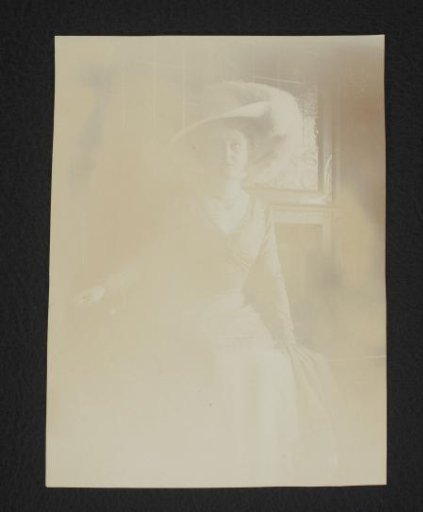 Portrait of a Woman with a Hat in an Interior
