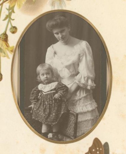 Portrait of a woman with a girl standing on a chair
