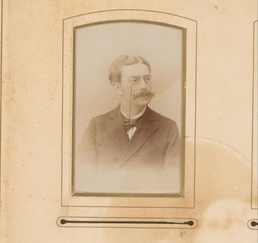 Portrait of a man with a mustache and spectacles