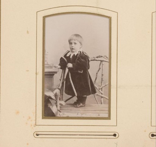 Portrait of a Toddler Standing on a Chair