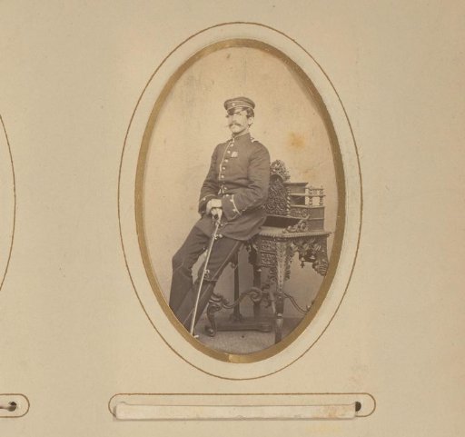 Portrait of a Man in Military Uniform Leaning on a Writing Desk