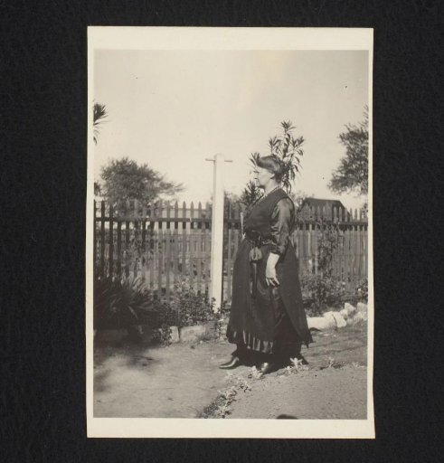 Woman in a garden, in profile