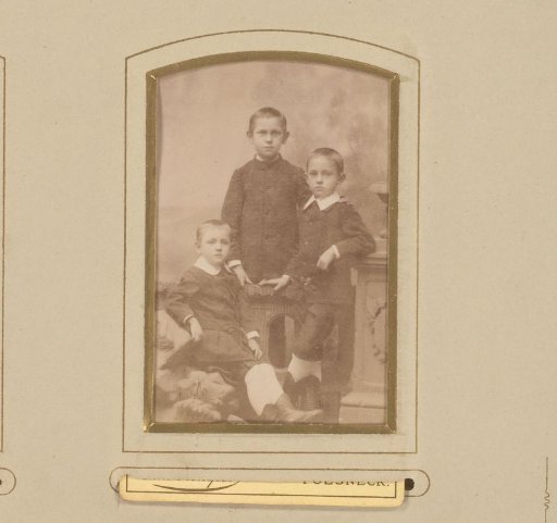 Portrait of three boys at a balustrade