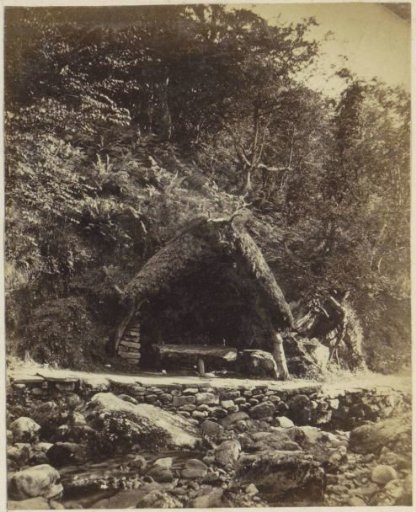 Primitive shelter along a road in an English landscape