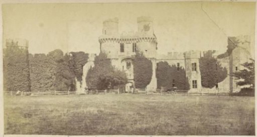 Ruin of Herstmonceux Castle in East Sussex with Two Carriages and a Woman in Front