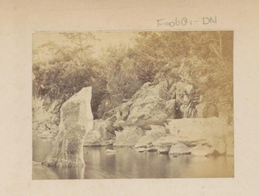 Boulders along water, probably in England