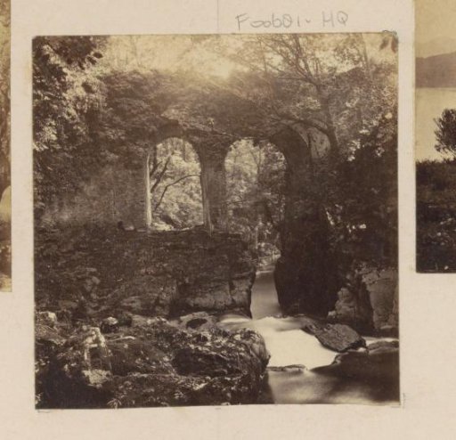 Landscape with an Old Overgrown Bridge over a River in England
