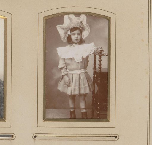 Portrait of a standing girl with a hat